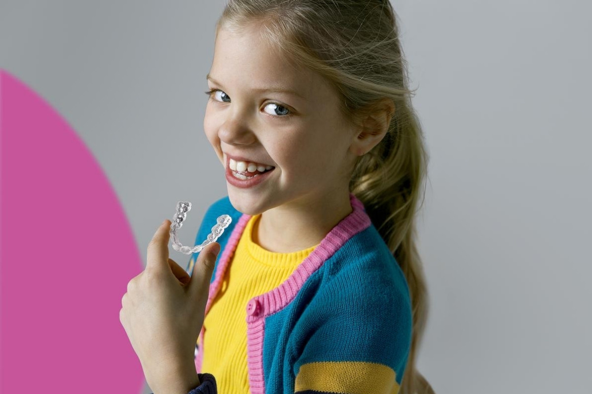 Young child at age 7 having a first orthodontic check-up with Dr. Siju George